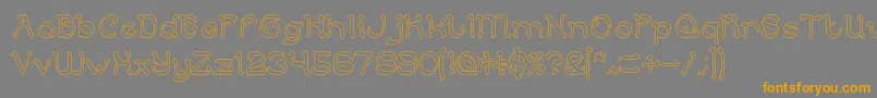 フォントArabianKnightHollow – オレンジの文字は灰色の背景にあります。