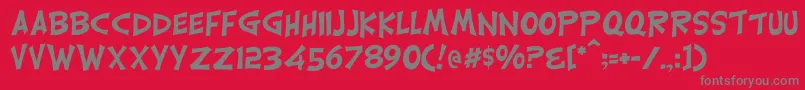 フォントCarrickgroovy – 赤い背景に灰色の文字