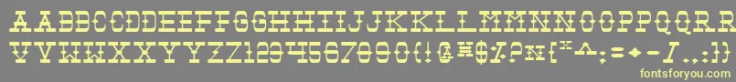 Tombv2e-fontti – keltaiset fontit harmaalla taustalla