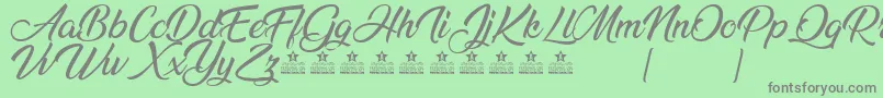 AnandaPersonalUse Font – Gray Fonts on Green Background