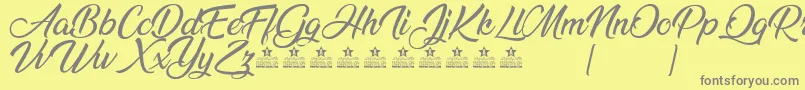 AnandaPersonalUse Font – Gray Fonts on Yellow Background