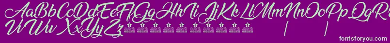 AnandaPersonalUse Font – Green Fonts on Purple Background
