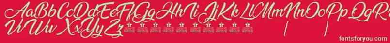 AnandaPersonalUse Font – Green Fonts on Red Background