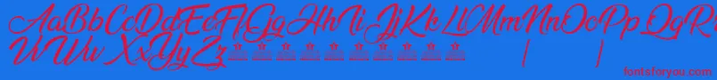 AnandaPersonalUse Font – Red Fonts on Blue Background