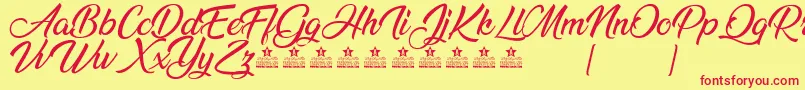 AnandaPersonalUse Font – Red Fonts on Yellow Background