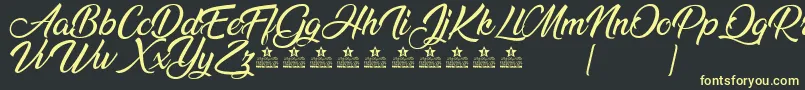 AnandaPersonalUse Font – Yellow Fonts on Black Background