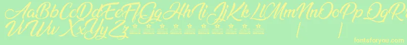 AnandaPersonalUse Font – Yellow Fonts on Green Background
