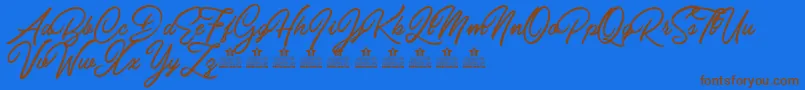 Шрифт CarolinaMountainsPersonalUse – коричневые шрифты на синем фоне