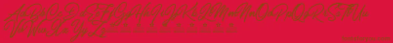 Czcionka CarolinaMountainsPersonalUse – brązowe czcionki na czerwonym tle