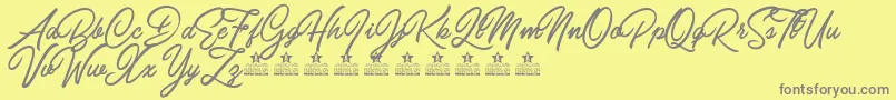 CarolinaMountainsPersonalUse-fontti – harmaat kirjasimet keltaisella taustalla