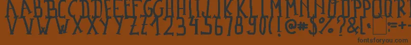 MadalenLetter Font – Black Fonts on Brown Background