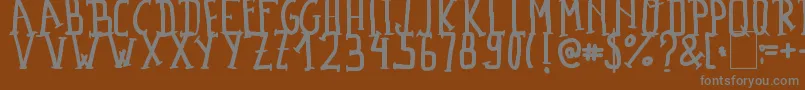MadalenLetter Font – Gray Fonts on Brown Background