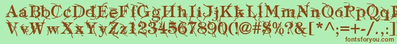 Fonte TypographyTiesBold – fontes marrons em um fundo verde