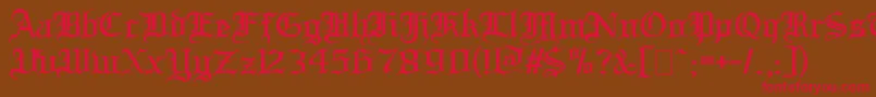 フォントBloodandblade – 赤い文字が茶色の背景にあります。