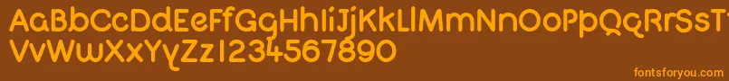 QuigletFree Font – Orange Fonts on Brown Background