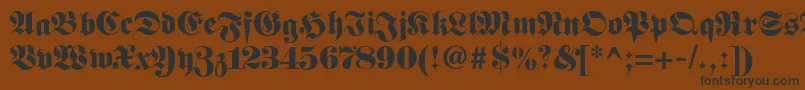 Fetteunzfraktur-fontti – mustat fontit ruskealla taustalla