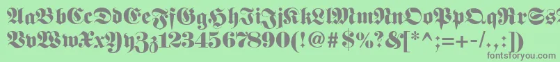 フォントFetteunzfraktur – 緑の背景に灰色の文字
