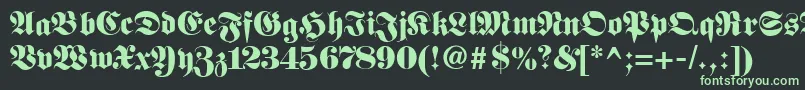 Fetteunzfraktur-fontti – vihreät fontit mustalla taustalla