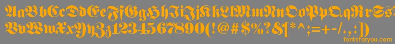 Fetteunzfraktur-fontti – oranssit fontit harmaalla taustalla