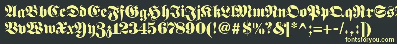 Шрифт Fetteunzfraktur – жёлтые шрифты на чёрном фоне
