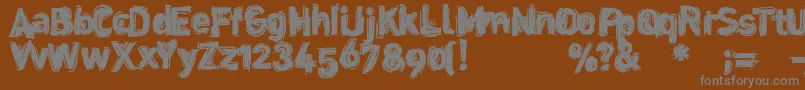 Dinstik Font – Gray Fonts on Brown Background