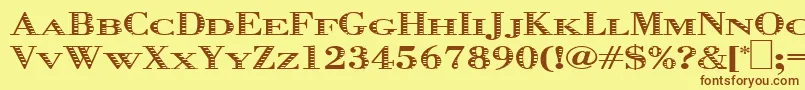 フォントGraphis – 茶色の文字が黄色の背景にあります。