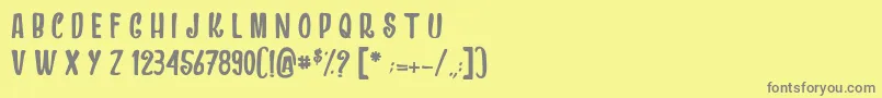 フォントDragonsAndChickens – 黄色の背景に灰色の文字