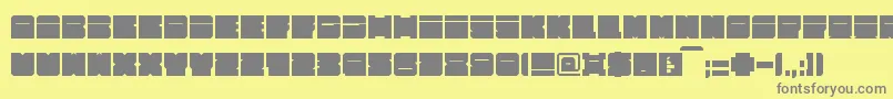 Alpha63-fontti – harmaat kirjasimet keltaisella taustalla