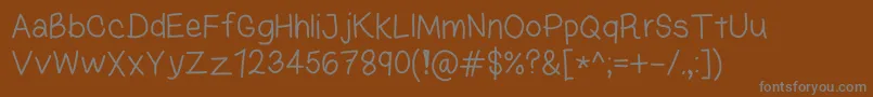 KasukiHandLight-fontti – harmaat kirjasimet ruskealla taustalla