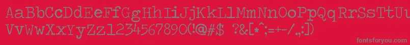 フォントTravelingtypewriter – 赤い背景に灰色の文字