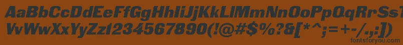 BlackgroteskcItalic-fontti – mustat fontit ruskealla taustalla