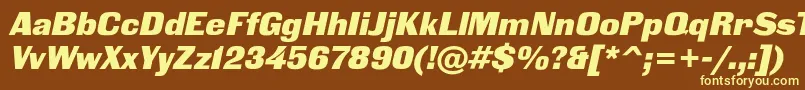 BlackgroteskcItalic-fontti – keltaiset fontit ruskealla taustalla