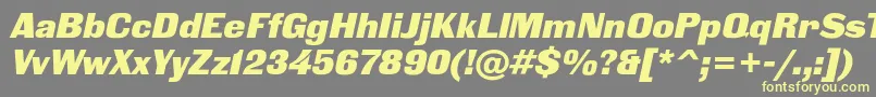 BlackgroteskcItalic-fontti – keltaiset fontit harmaalla taustalla