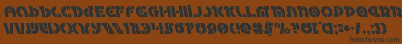 Questlokleft Font – Black Fonts on Brown Background