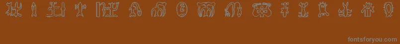 フォントRongorongoGlyphs – 茶色の背景に灰色の文字