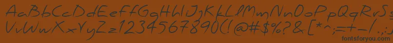 PfscandalproRegular Font – Black Fonts on Brown Background