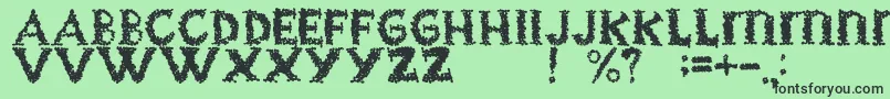 Czcionka BlackgrapesRegular – czarne czcionki na zielonym tle