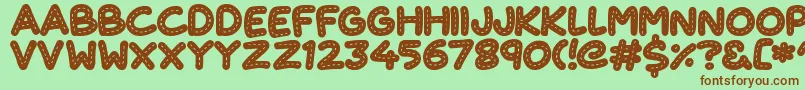 CuteStitch Font – Brown Fonts on Green Background