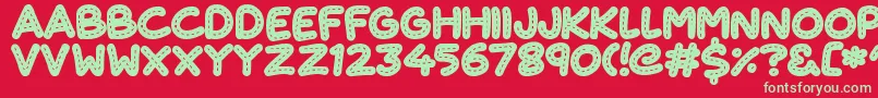 CuteStitch Font – Green Fonts on Red Background