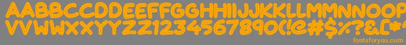 CuteStitch Font – Orange Fonts on Gray Background