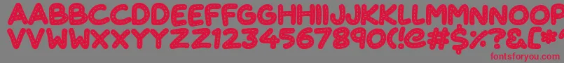 CuteStitch-Schriftart – Rote Schriften auf grauem Hintergrund
