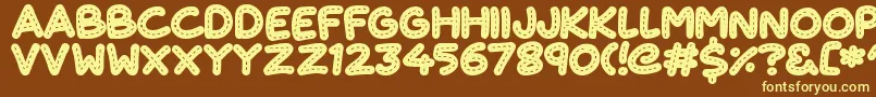 CuteStitch Font – Yellow Fonts on Brown Background