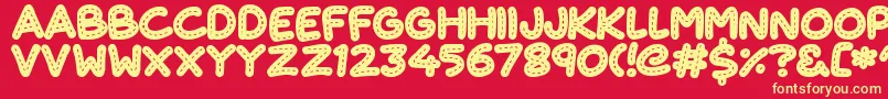 Fonte CuteStitch – fontes amarelas em um fundo vermelho