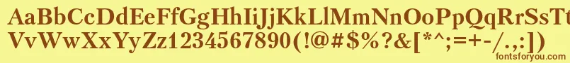 フォントPetersburgosttBold – 茶色の文字が黄色の背景にあります。