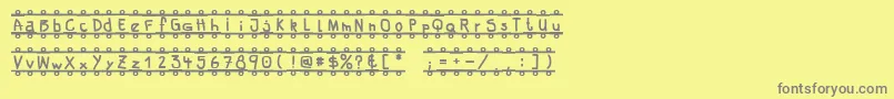 FeBanner Font – Gray Fonts on Yellow Background