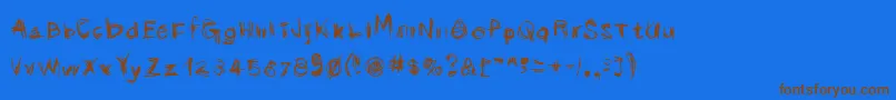 フォントScribbli – 茶色の文字が青い背景にあります。