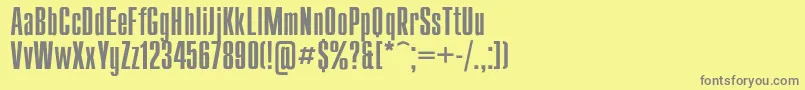 Compact-fontti – harmaat kirjasimet keltaisella taustalla