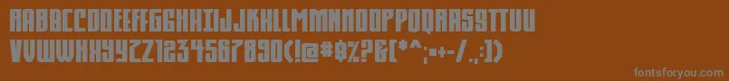 Komikahuna-fontti – harmaat kirjasimet ruskealla taustalla