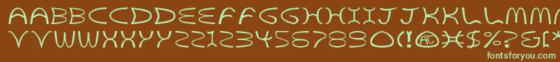 フォントGoldenArchesBold – 緑色の文字が茶色の背景にあります。