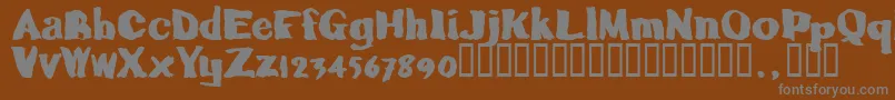 Caljoetrial-fontti – harmaat kirjasimet ruskealla taustalla
